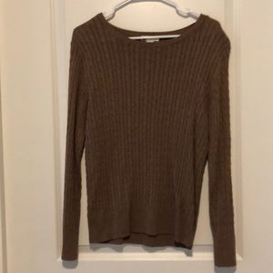 Tan cable knit sweater.